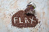 Flax seeds with 'FLAX' letters