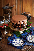 A chocolate cream cake with ganache