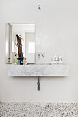 Marble sink and terrazzo floor in bathroom