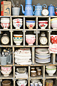 Various nostalgic dishes on an old shelving unit