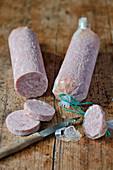 Lightly smoked country sausage, partially sliced