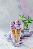 Blueberry ice cream in a waffle cone