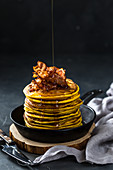 Spicy sweet potato pancakes with bacon and maple syrup