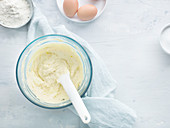 Sponge cake being made: butter and eggs being mixed