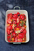 Smoked tomato soup being made: tomatoes in a roasting tin
