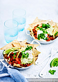 Black bean chilli with guacamole and corn chips