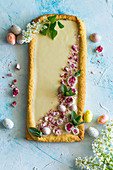 Easter cake decorated with crumbled confectionery eggs