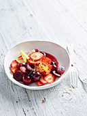 Fruit salad with cherries and strawberries