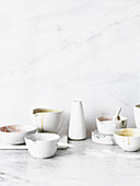 Unwashed bowls on white marble background