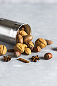 Tin with various nuts and spices