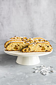 Traditional Christmas Stollen cake with marzipan and candied fruit