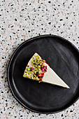 A slice of pistachio cheesecake