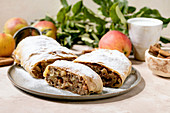 Homemade sliced classic apple strudel with icing sugar