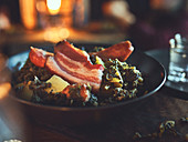 Kale with pork belly made in a Dutch oven