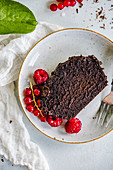 Chocolate cake with fresh currants and raspberries