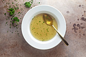 A bowl of clear vegetable broth