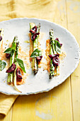 Green asparagus with cherries, basil and Parmesan puff pastry