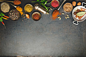 Oriental herbs and spices on dark background