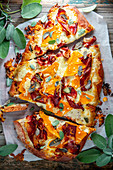 Spelt pizza with butternut squash, bacon and sage