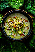 Portuguese smoked fish soup with savoy cabbage