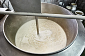 Tofu production: Stirring soy mash