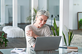 Senior woman using computer