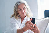 Senior woman using health app