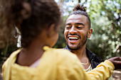 Happy father and daughter in park