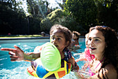 Mother and daughter on inflatable raft playing
