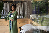 Portrait confident female shop owner in home goods shop