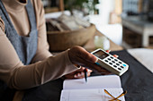 Shop owner holding credit card reader