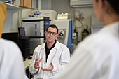 Scientists talking in laboratory