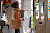 Woman receiving packages from delivery person