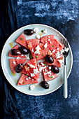 Watermelon salad with black olives, feta cheese, fresh mint and preserved lemon