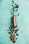 Vintage manual coffee grinder, coffee beans and spices
