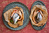 Langoustines with sea bream uncooked in paper