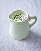 Cream with herbs in a jug