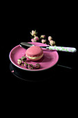 Pink macaron with dried rosebuds