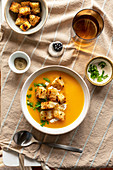 Butternut squash soup with croutons and parsley