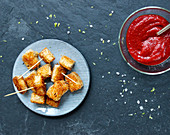 Vegan tofu nuggets with coconut flakes and kid's ketchup