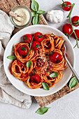 Spaghetti with vegan tomato sauce and cashew-parmesan substitute