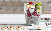 Chia pudding with fruit, almonds and cocoa nibs