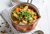 Stew with pasta, spring vegetables and kohlrabi pesto