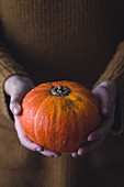 Woman holding pumpkin