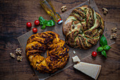 Spicy yeast wreaths with red and green pesto