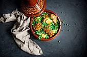 Moroccan chicken tagine with lemons and peas