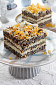 Poppy seed cake layer with orange and almond flakes
