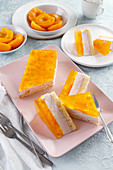 Summer cake with peach jelly and pieces of peaches