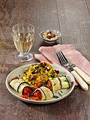 Vegetarian courgette roulade with paella