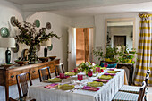 Set table and antique sideboard in dining room